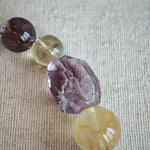 This is a rainbow energy bracelet that consists of Aquamarine, Amethyst, Clear Quartz, White Phantom Quartz, Citrine, Prehnite, Golden Healer, and Herkimer Diamond.