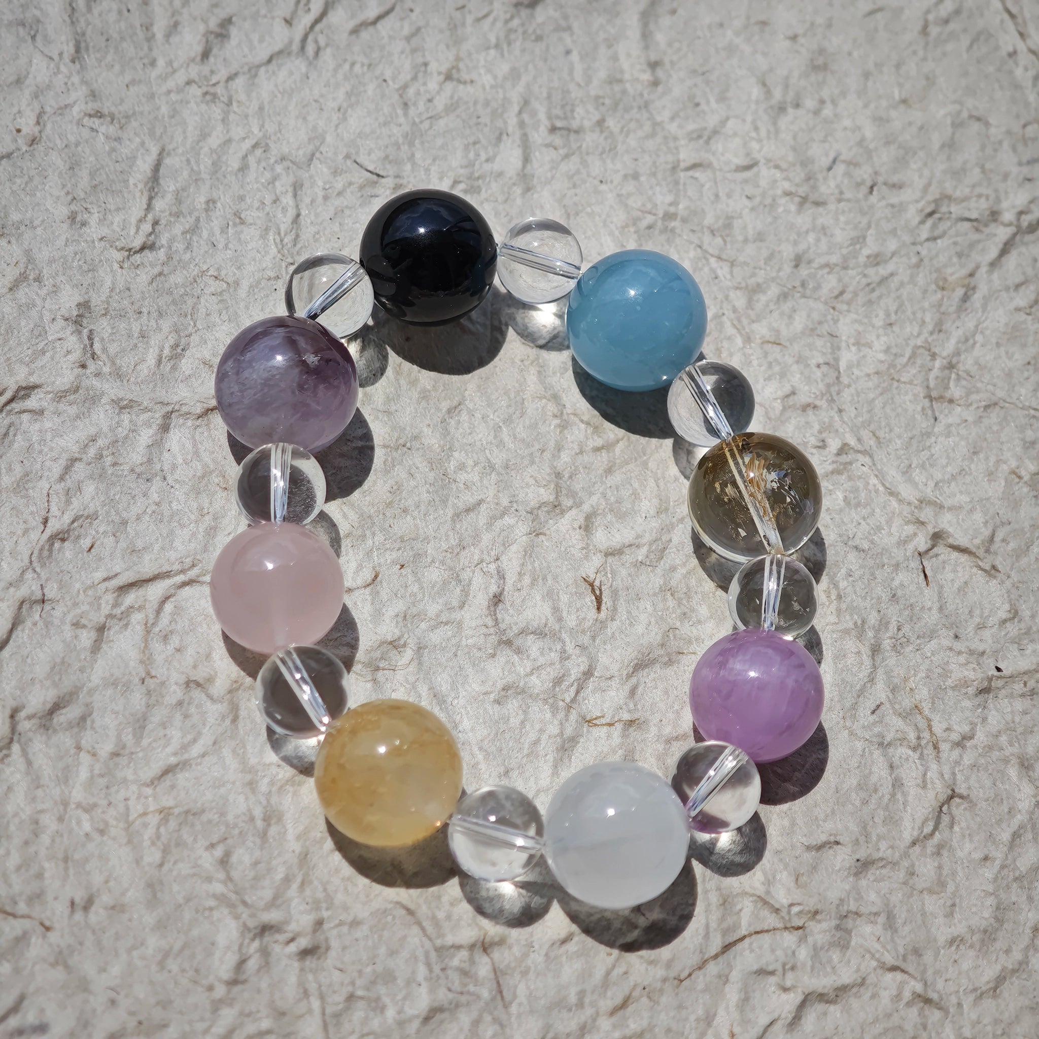 This is a multi-gemstone bracelets consists of Aquamarine, Amethyst, Citrine and White Phantom, etc.