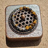 This is a tiger's eye bracelet with clear quartz and gold-plated copper spacer.