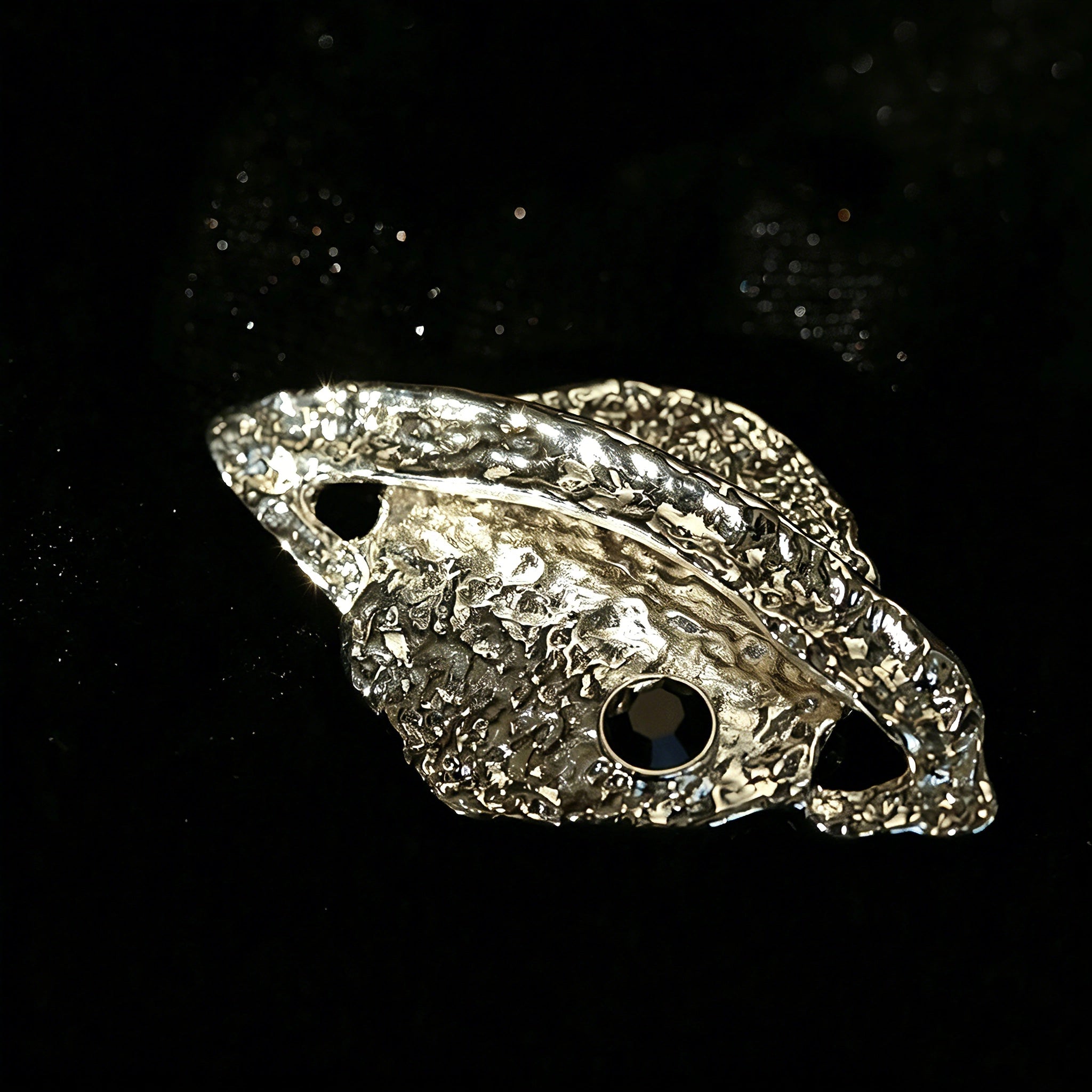 These vintage-style brooches come in star and Saturn-inspired planet shapes, with a hammered, textured finish in gold or silver tone. Each design is accented with a central gemstone, including pearl, red agate, or black onyx, adding a touch of celestial charm to any outfit.