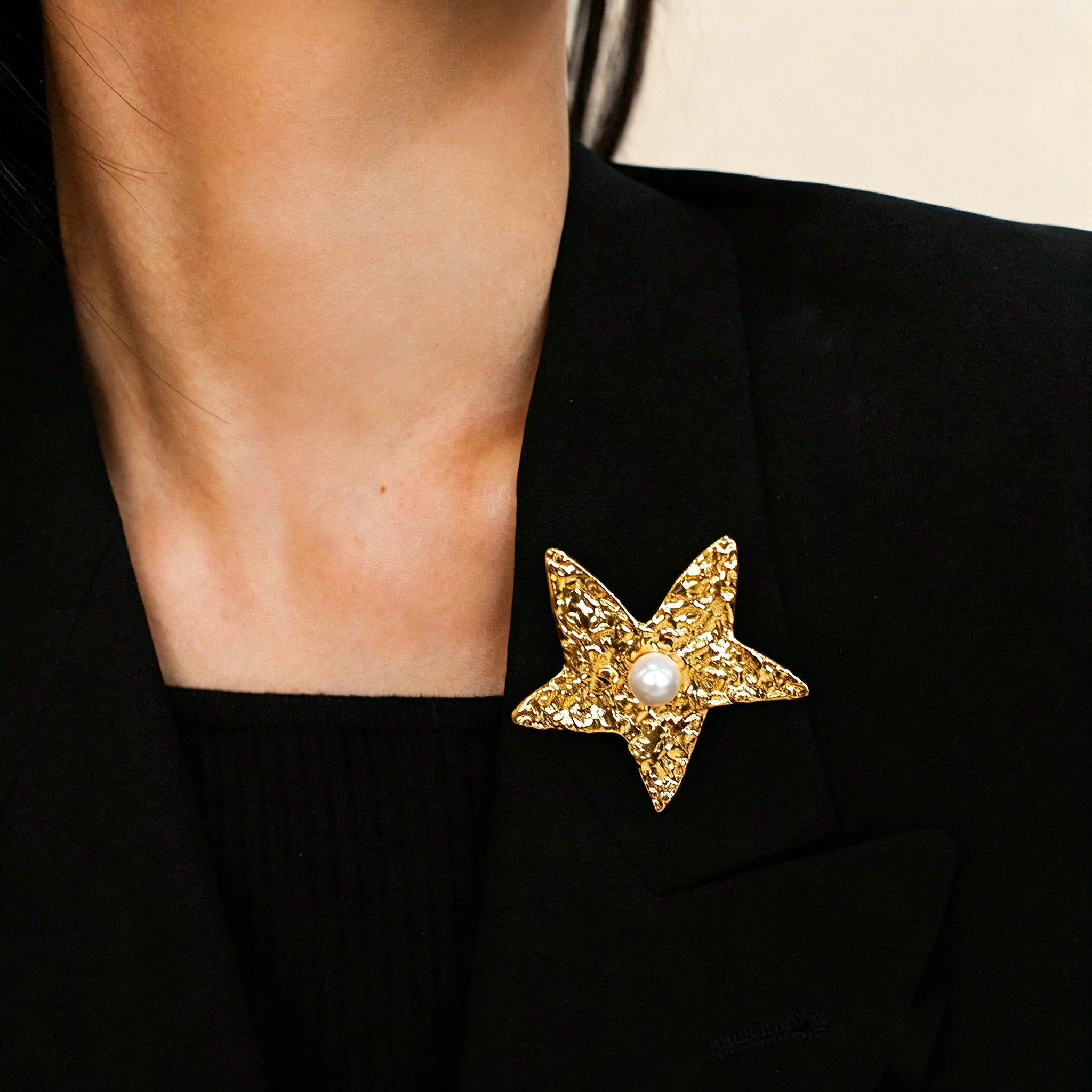 These vintage-style brooches come in star and Saturn-inspired planet shapes, with a hammered, textured finish in gold or silver tone. Each design is accented with a central gemstone, including pearl, red agate, or black onyx, adding a touch of celestial charm to any outfit.