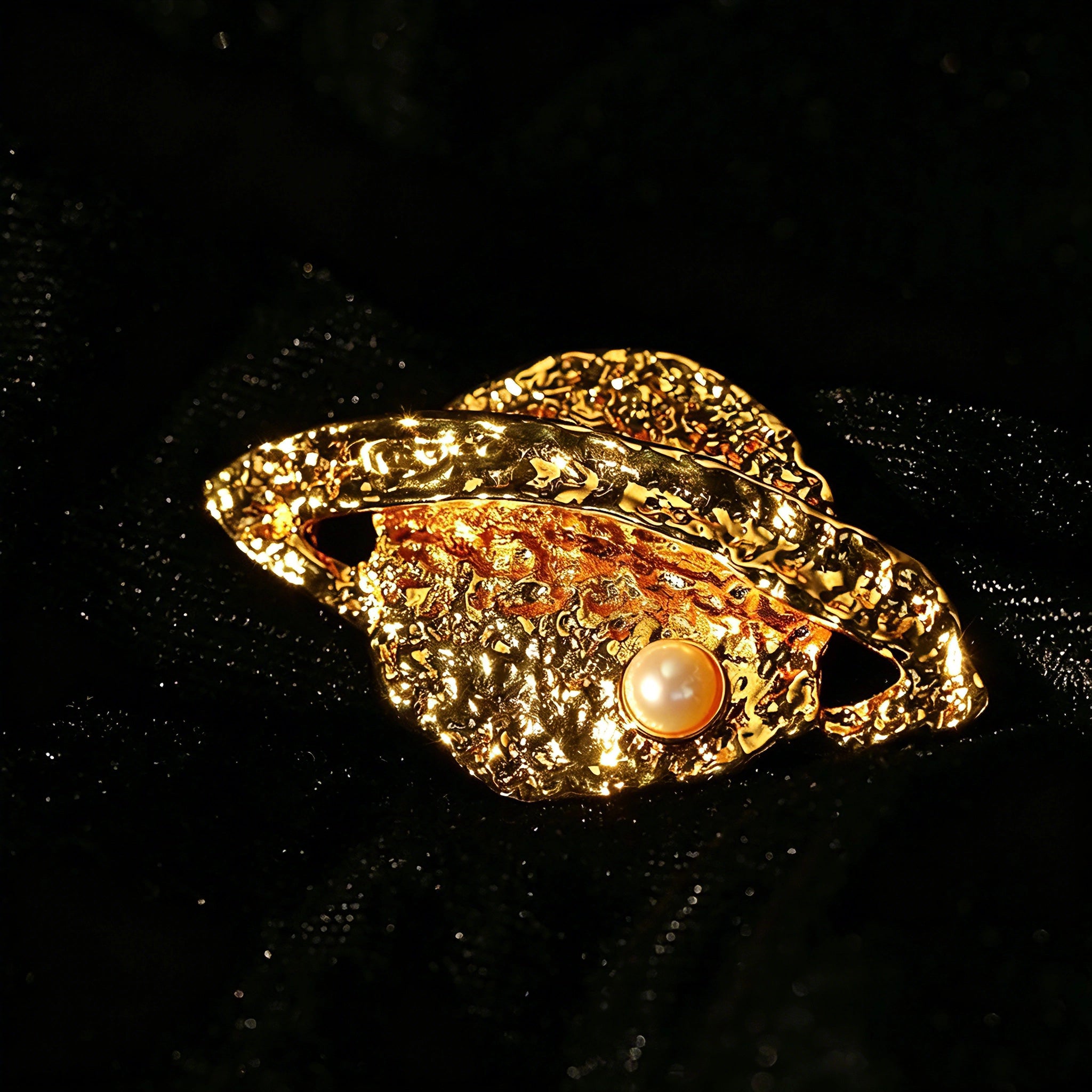 These vintage-style brooches come in star and Saturn-inspired planet shapes, with a hammered, textured finish in gold or silver tone. Each design is accented with a central gemstone, including pearl, red agate, or black onyx, adding a touch of celestial charm to any outfit.
