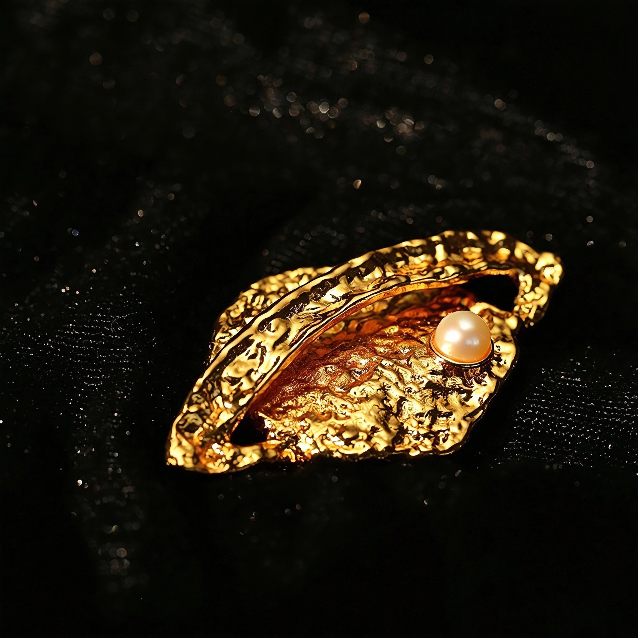 These vintage-style brooches come in star and Saturn-inspired planet shapes, with a hammered, textured finish in gold or silver tone. Each design is accented with a central gemstone, including pearl, red agate, or black onyx, adding a touch of celestial charm to any outfit.