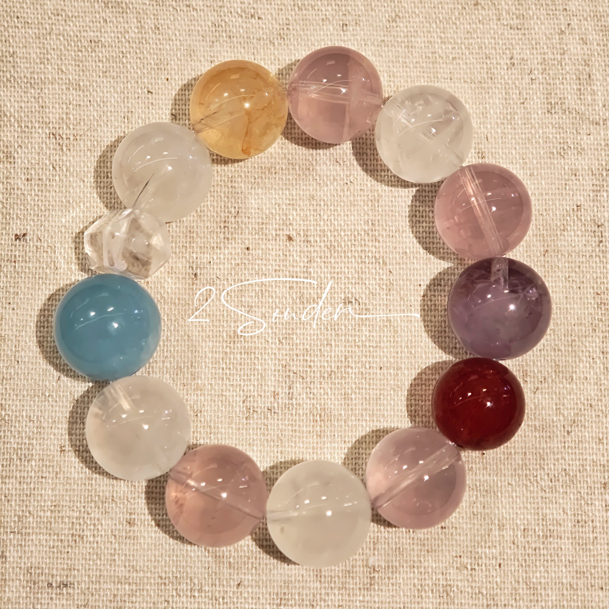 This is a multi gemstone bracelet consists of White Phantom Quartz, Aquamarine, Raw Clear Quartz, Starry Pink Quartz, and Lavender Amethyst.  The colors are close to pastel shades, making them perfect for spring and summer wear.