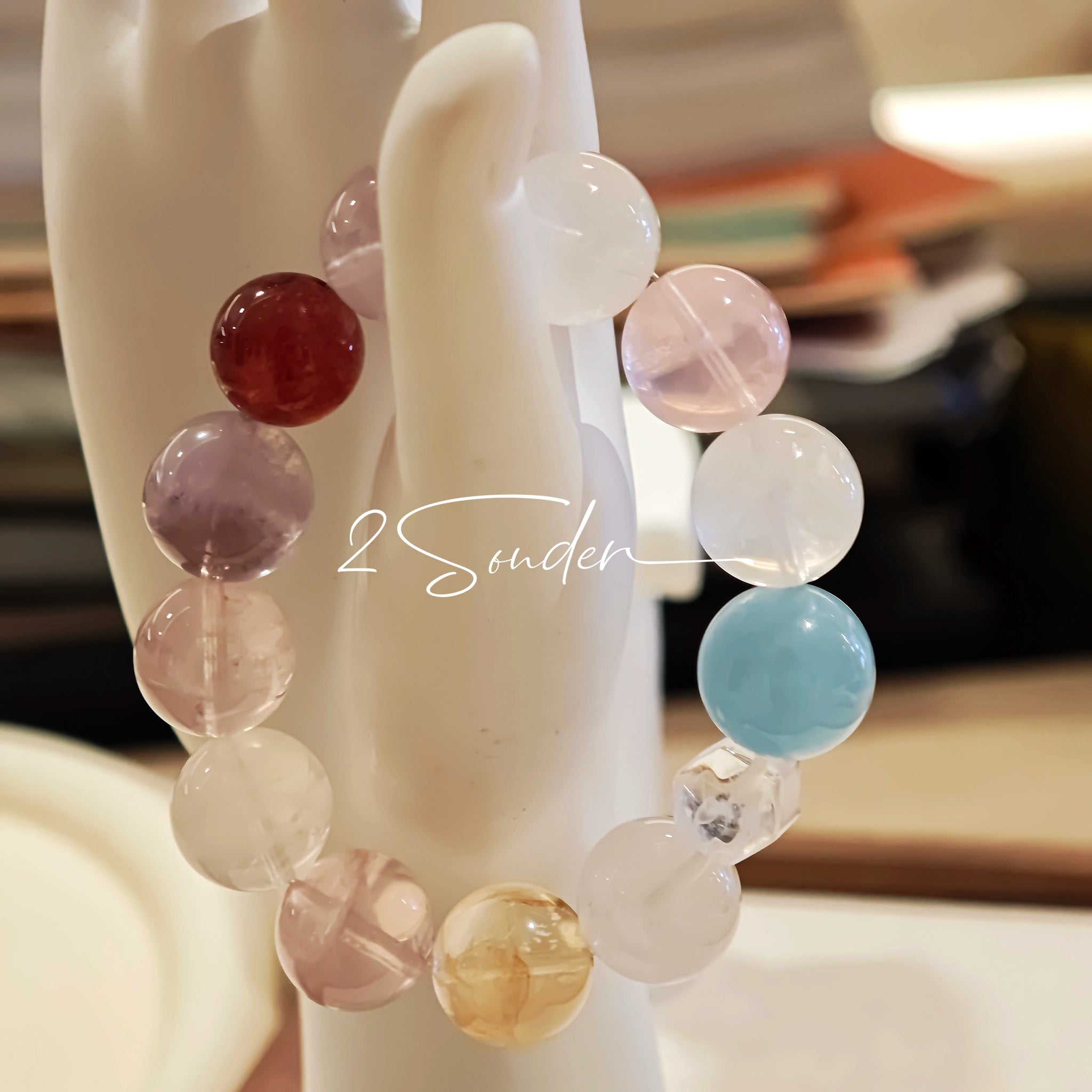 This is a multi gemstone bracelet consists of White Phantom Quartz, Aquamarine, Raw Clear Quartz, Starry Pink Quartz, and Lavender Amethyst.  The colors are close to pastel shades, making them perfect for spring and summer wear.