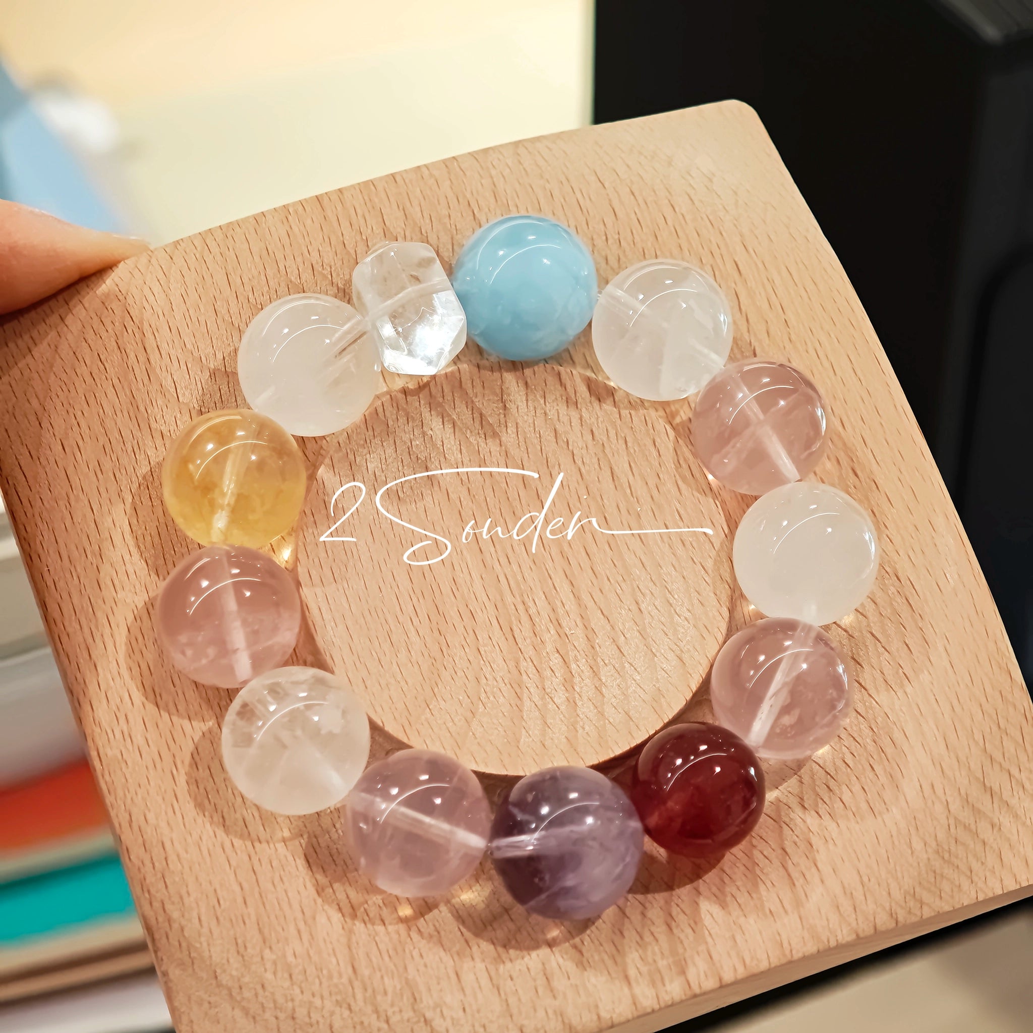 This is a multi gemstone bracelet consists of White Phantom Quartz, Aquamarine, Raw Clear Quartz, Starry Pink Quartz, and Lavender Amethyst.  The colors are close to pastel shades, making them perfect for spring and summer wear.
