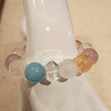 This is a multi gemstone bracelet consists of White Phantom Quartz, Aquamarine, Raw Clear Quartz, Starry Pink Quartz, and Lavender Amethyst.  The colors are close to pastel shades, making them perfect for spring and summer wear.