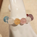 This is a multi gemstone bracelet consists of White Phantom Quartz, Aquamarine, Raw Clear Quartz, Starry Pink Quartz, and Lavender Amethyst.  The colors are close to pastel shades, making them perfect for spring and summer wear.