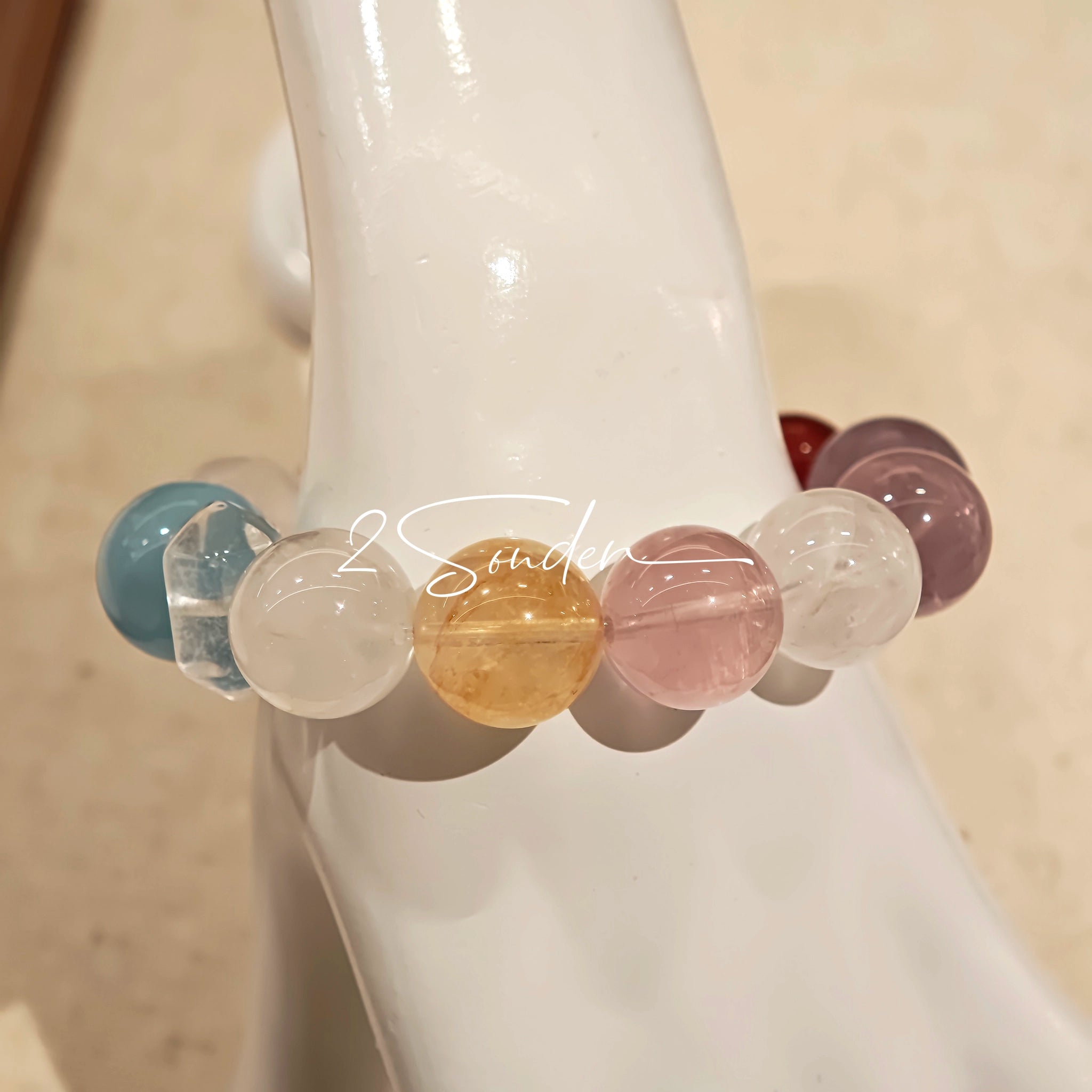 This is a multi gemstone bracelet consists of White Phantom Quartz, Aquamarine, Raw Clear Quartz, Starry Pink Quartz, and Lavender Amethyst.  The colors are close to pastel shades, making them perfect for spring and summer wear.