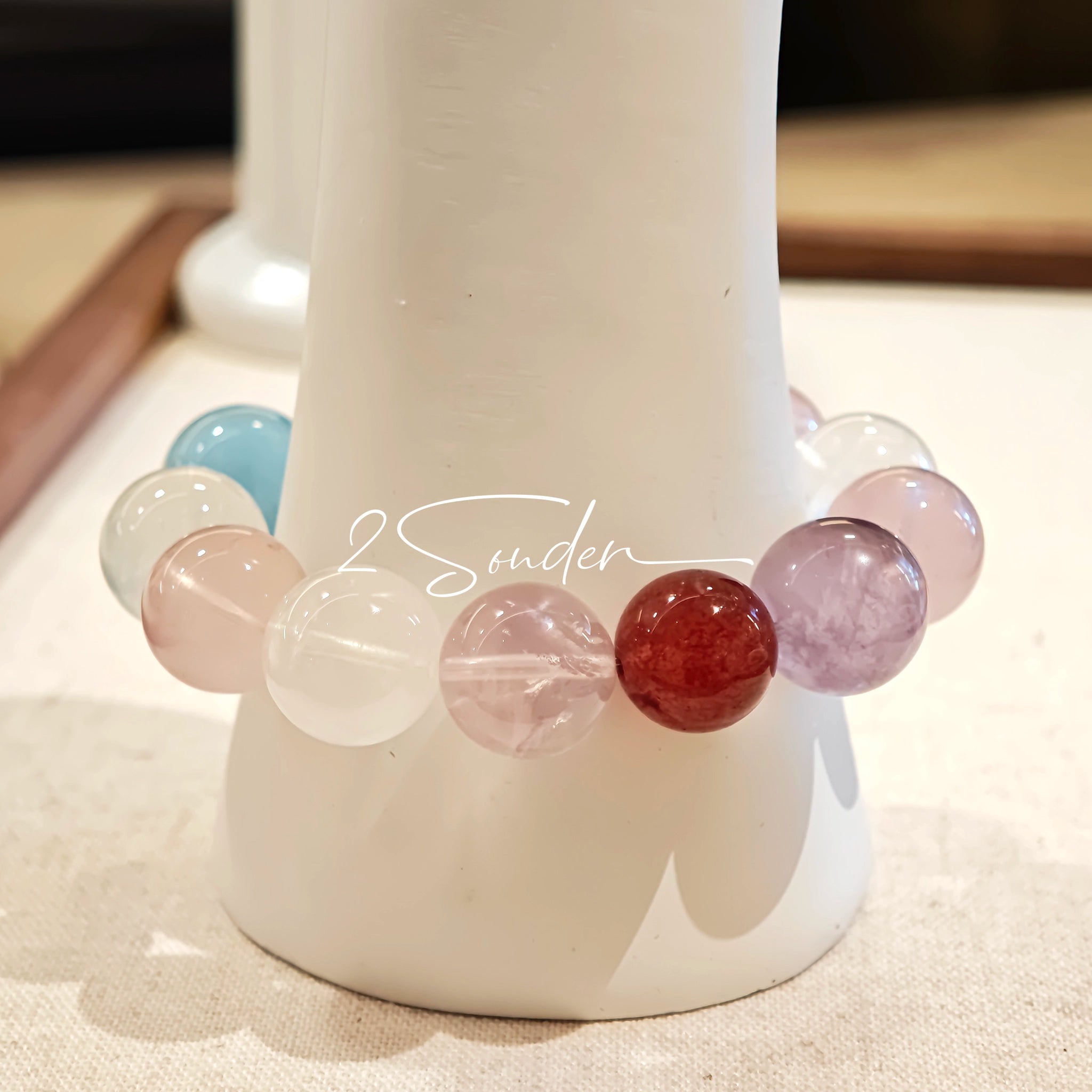 This is a multi gemstone bracelet consists of White Phantom Quartz, Aquamarine, Raw Clear Quartz, Starry Pink Quartz, and Lavender Amethyst.  The colors are close to pastel shades, making them perfect for spring and summer wear.