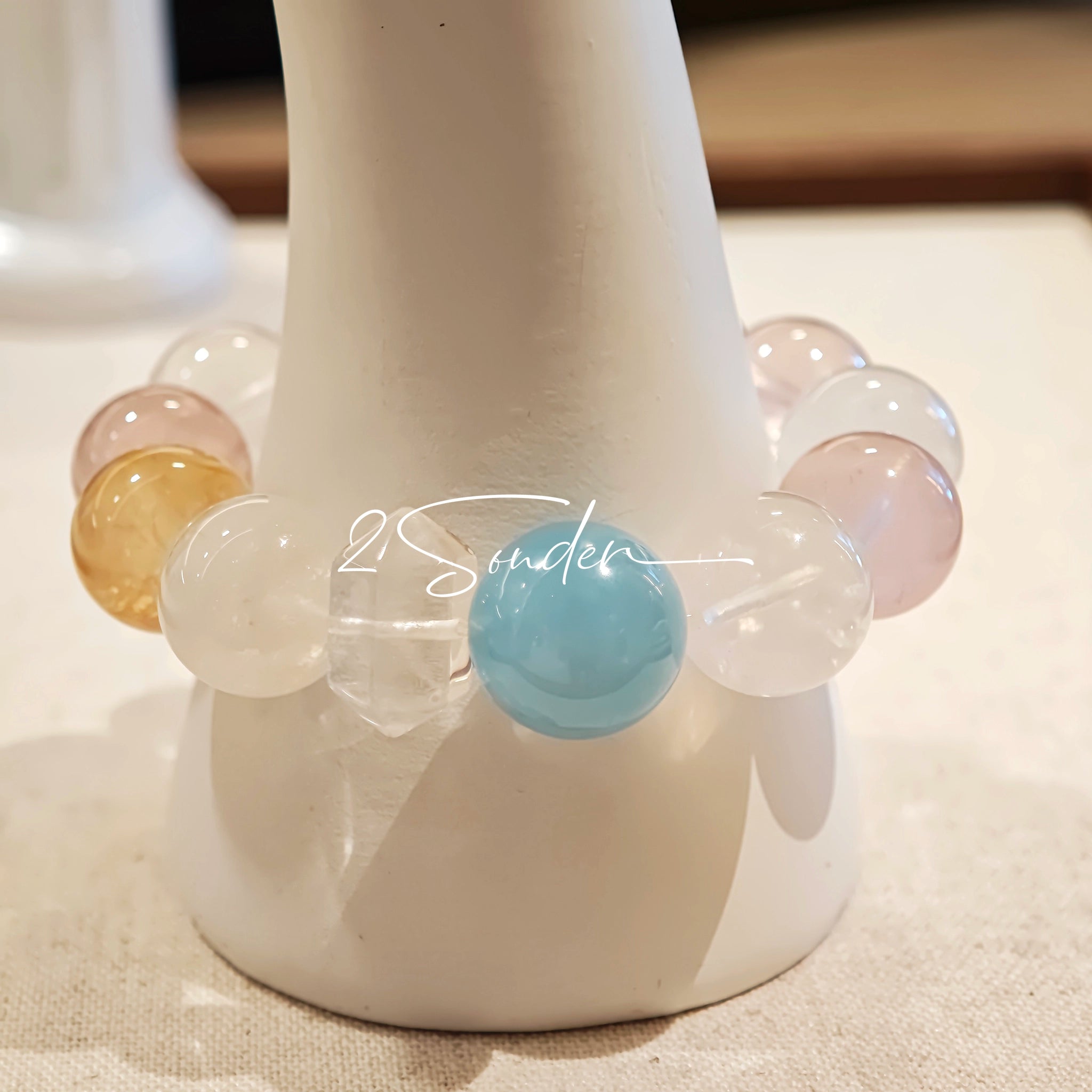This is a multi gemstone bracelet consists of White Phantom Quartz, Aquamarine, Raw Clear Quartz, Starry Pink Quartz, and Lavender Amethyst.  The colors are close to pastel shades, making them perfect for spring and summer wear.