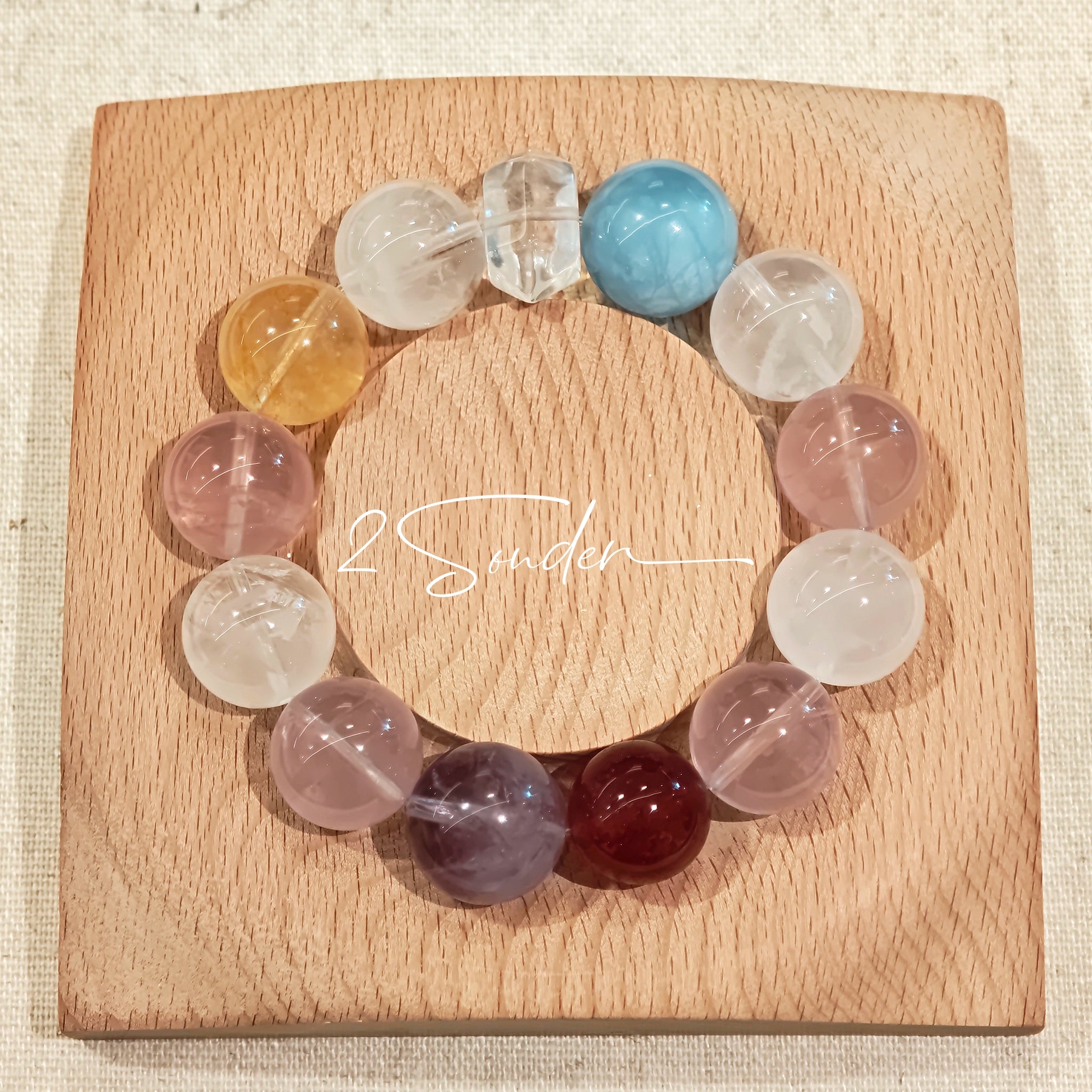 This is a multi gemstone bracelet consists of White Phantom Quartz, Aquamarine, Raw Clear Quartz, Starry Pink Quartz, and Lavender Amethyst.  The colors are close to pastel shades, making them perfect for spring and summer wear.