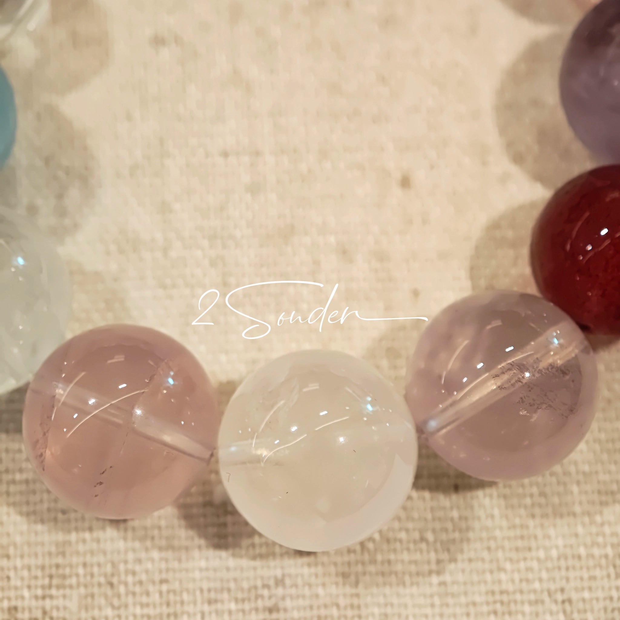 This is a multi gemstone bracelet consists of White Phantom Quartz, Aquamarine, Raw Clear Quartz, Starry Pink Quartz, and Lavender Amethyst.  The colors are close to pastel shades, making them perfect for spring and summer wear.