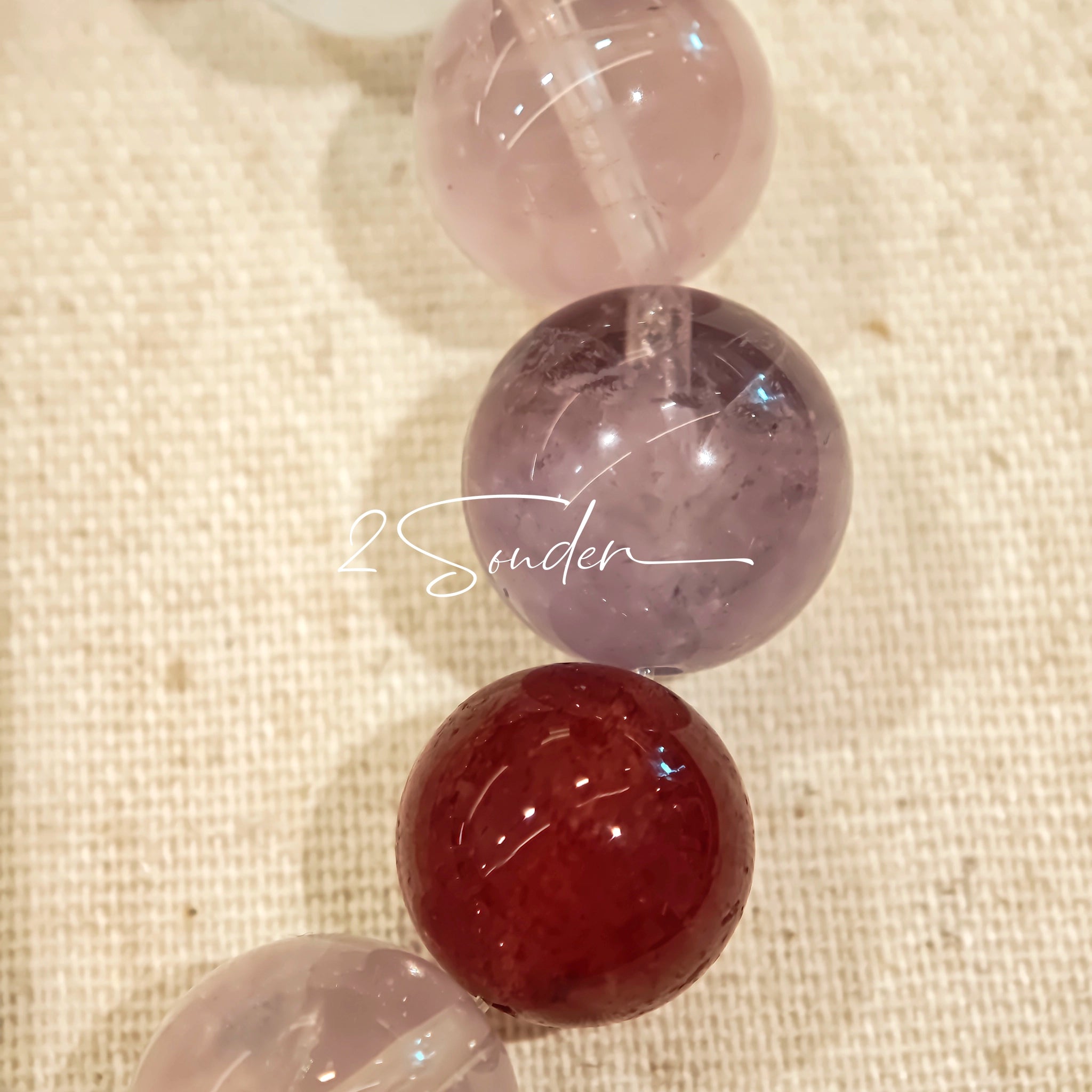 This is a multi gemstone bracelet consists of White Phantom Quartz, Aquamarine, Raw Clear Quartz, Starry Pink Quartz, and Lavender Amethyst.  The colors are close to pastel shades, making them perfect for spring and summer wear.