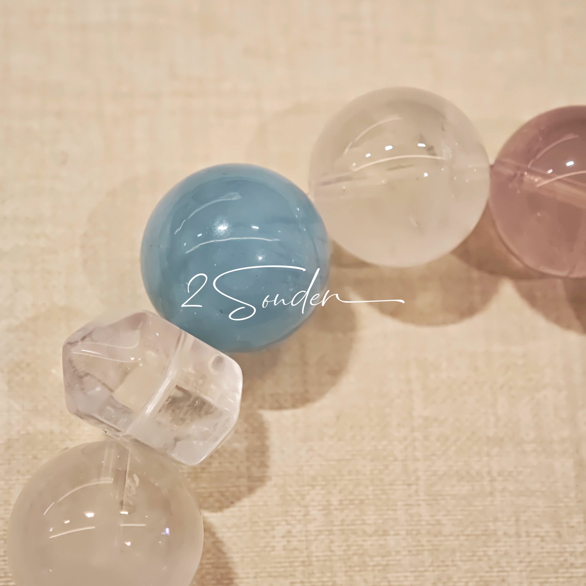 This is a multi gemstone bracelet consists of White Phantom Quartz, Aquamarine, Raw Clear Quartz, Starry Pink Quartz, and Lavender Amethyst.  The colors are close to pastel shades, making them perfect for spring and summer wear.