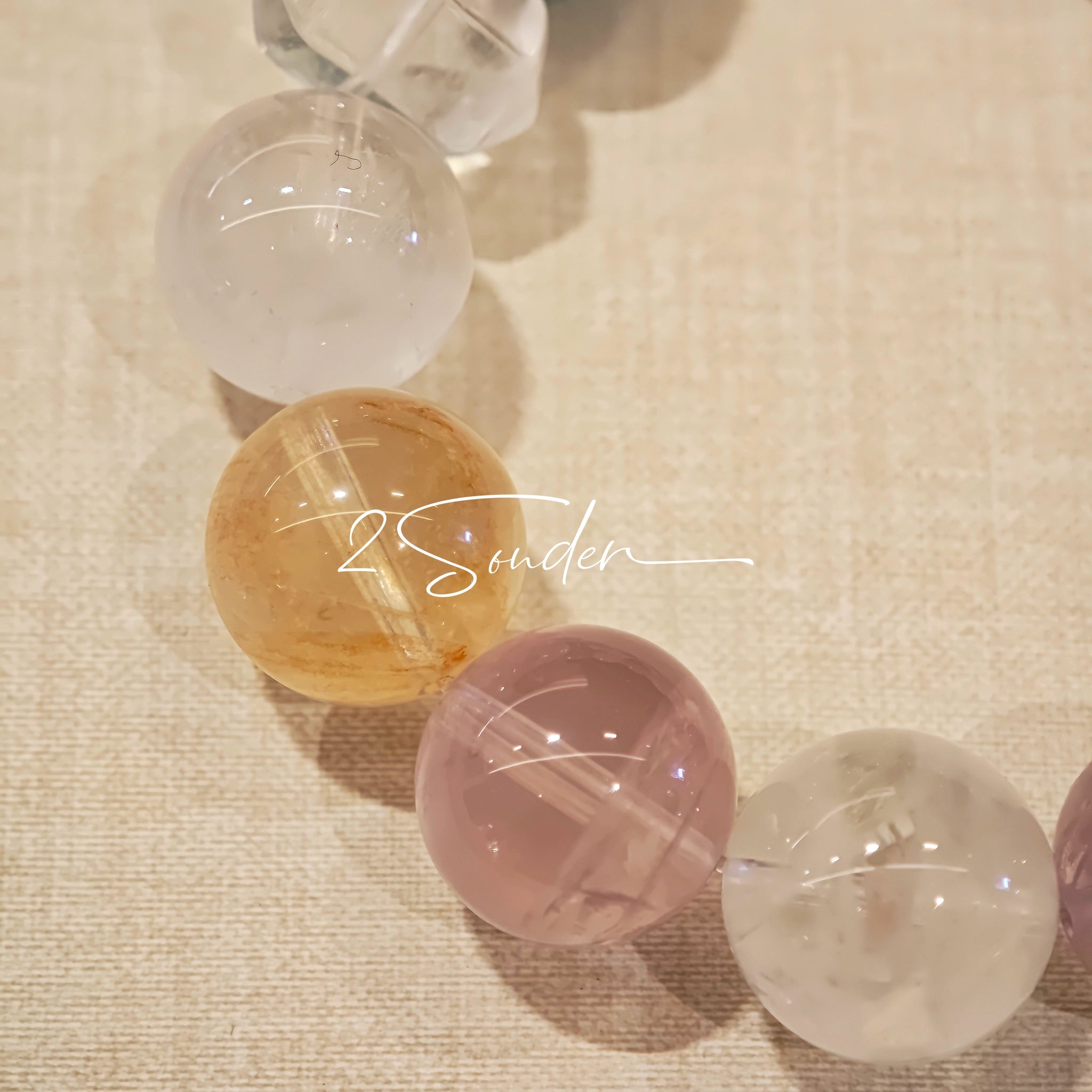 This is a multi gemstone bracelet consists of White Phantom Quartz, Aquamarine, Raw Clear Quartz, Starry Pink Quartz, and Lavender Amethyst.  The colors are close to pastel shades, making them perfect for spring and summer wear.