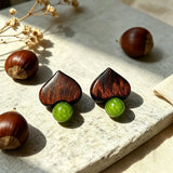 Crafted with dark wood heart‑shaped pieces paired with vivid green grape‑tone stone beads. This stud earring blends retro natural texture and fresh color contrast. It delivers a unique boho‑charm look for daily wear.