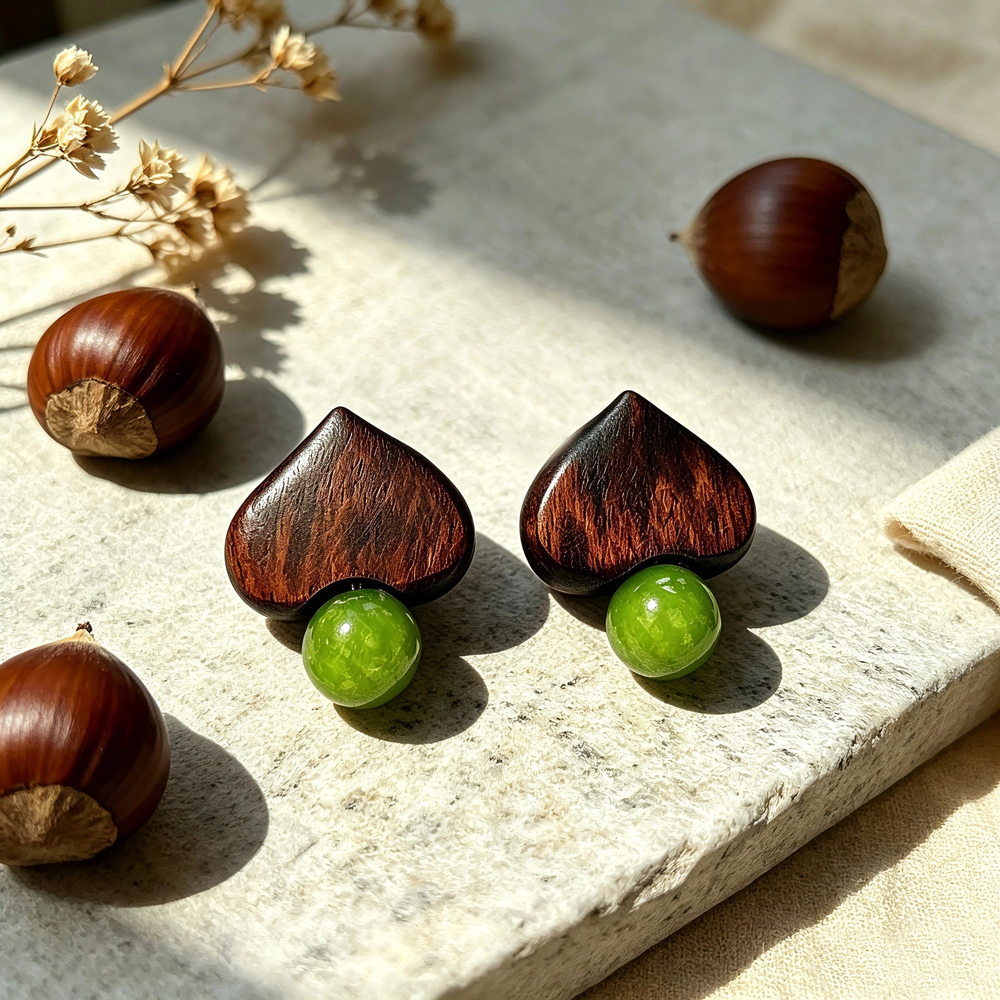 Crafted with dark wood heart‑shaped pieces paired with vivid green grape‑tone stone beads. This stud earring blends retro natural texture and fresh color contrast. It delivers a unique boho‑charm look for daily wear.