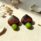 Crafted with dark wood heart‑shaped pieces paired with vivid green grape‑tone stone beads. This stud earring blends retro natural texture and fresh color contrast. It delivers a unique boho‑charm look for daily wear.