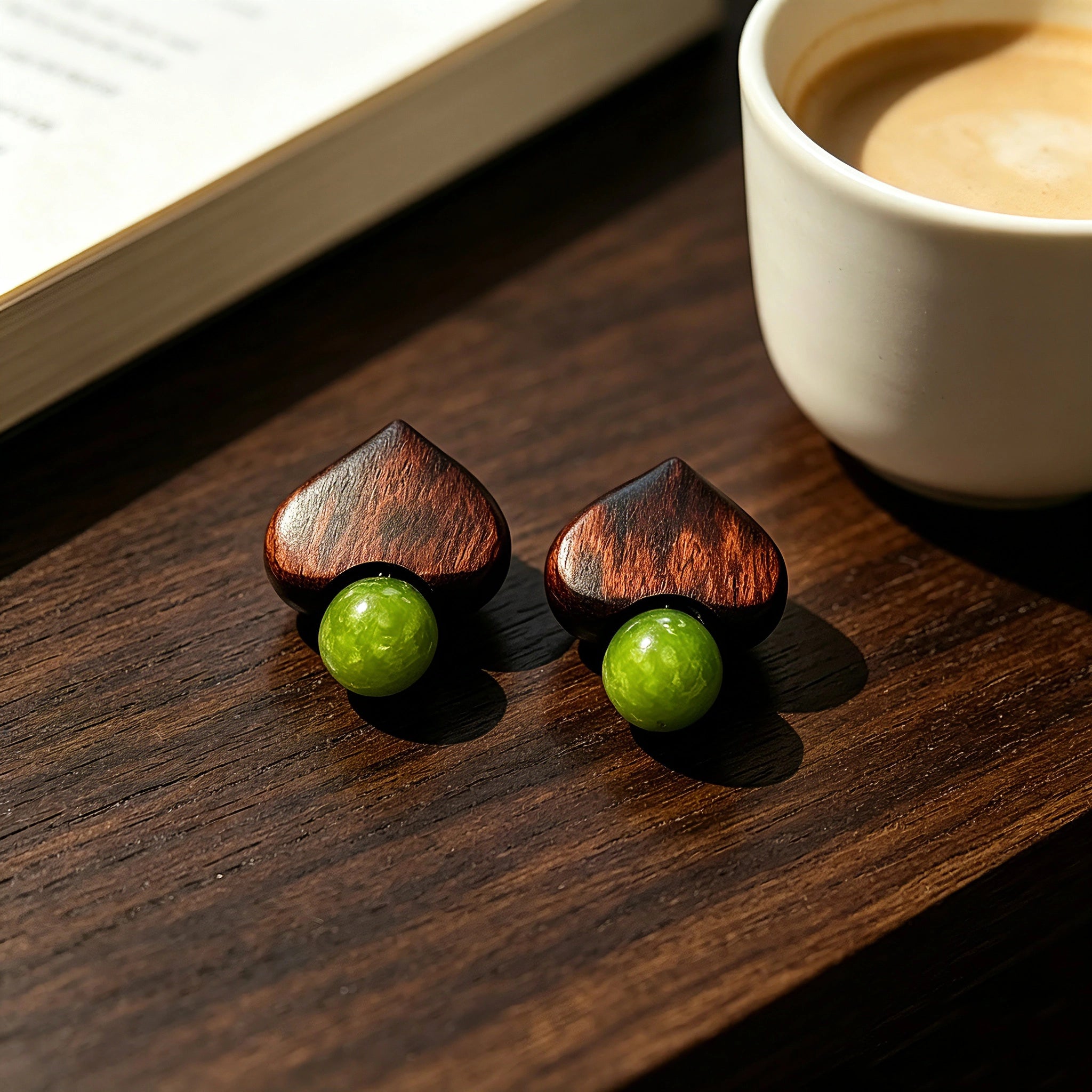 Crafted with dark wood heart‑shaped pieces paired with vivid green grape‑tone stone beads. This stud earring blends retro natural texture and fresh color contrast. It delivers a unique boho‑charm look for daily wear.