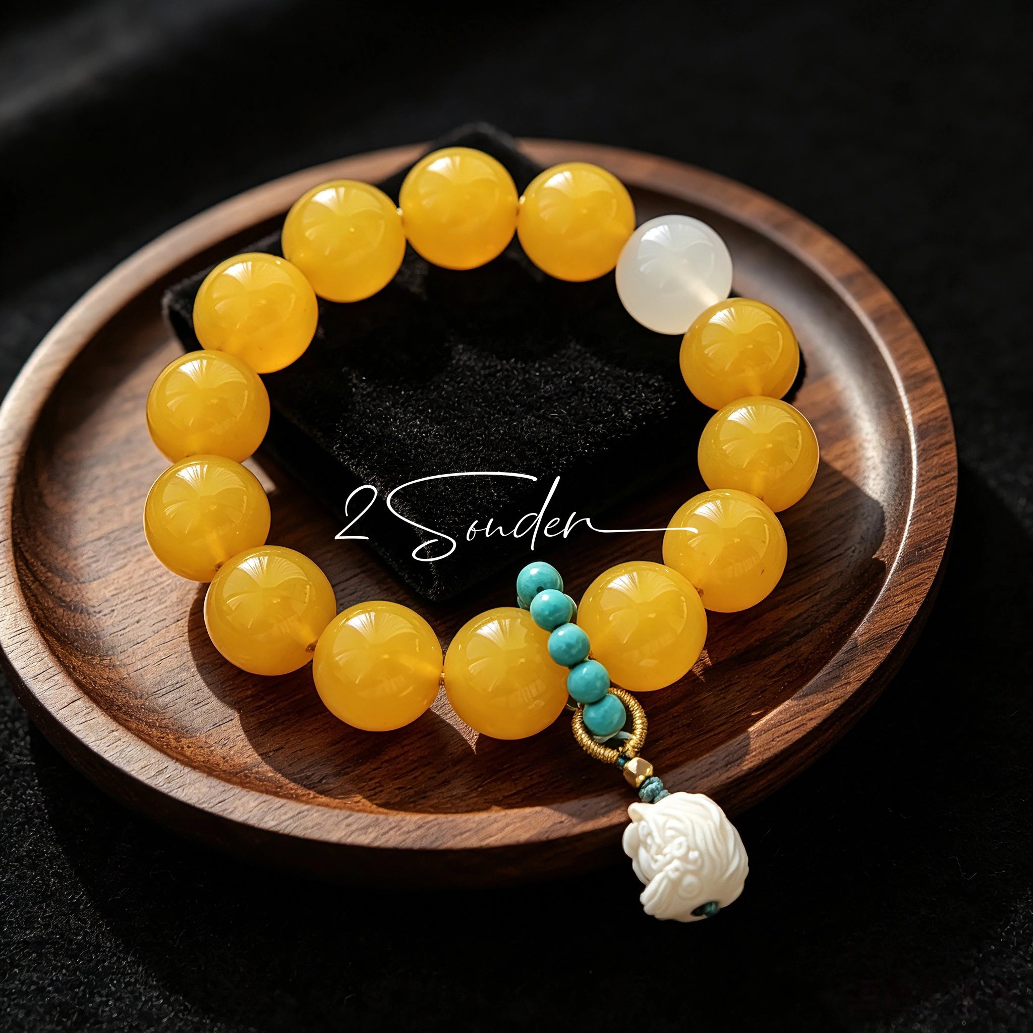 This handcrafted bracelet features glossy 14mm yellow agate beads paired with one white agate bead. It is accented with turquoise beads and finished with a detailed mammoth ivory guardian lion charm, bringing a warm vintage ethnic vibe.
