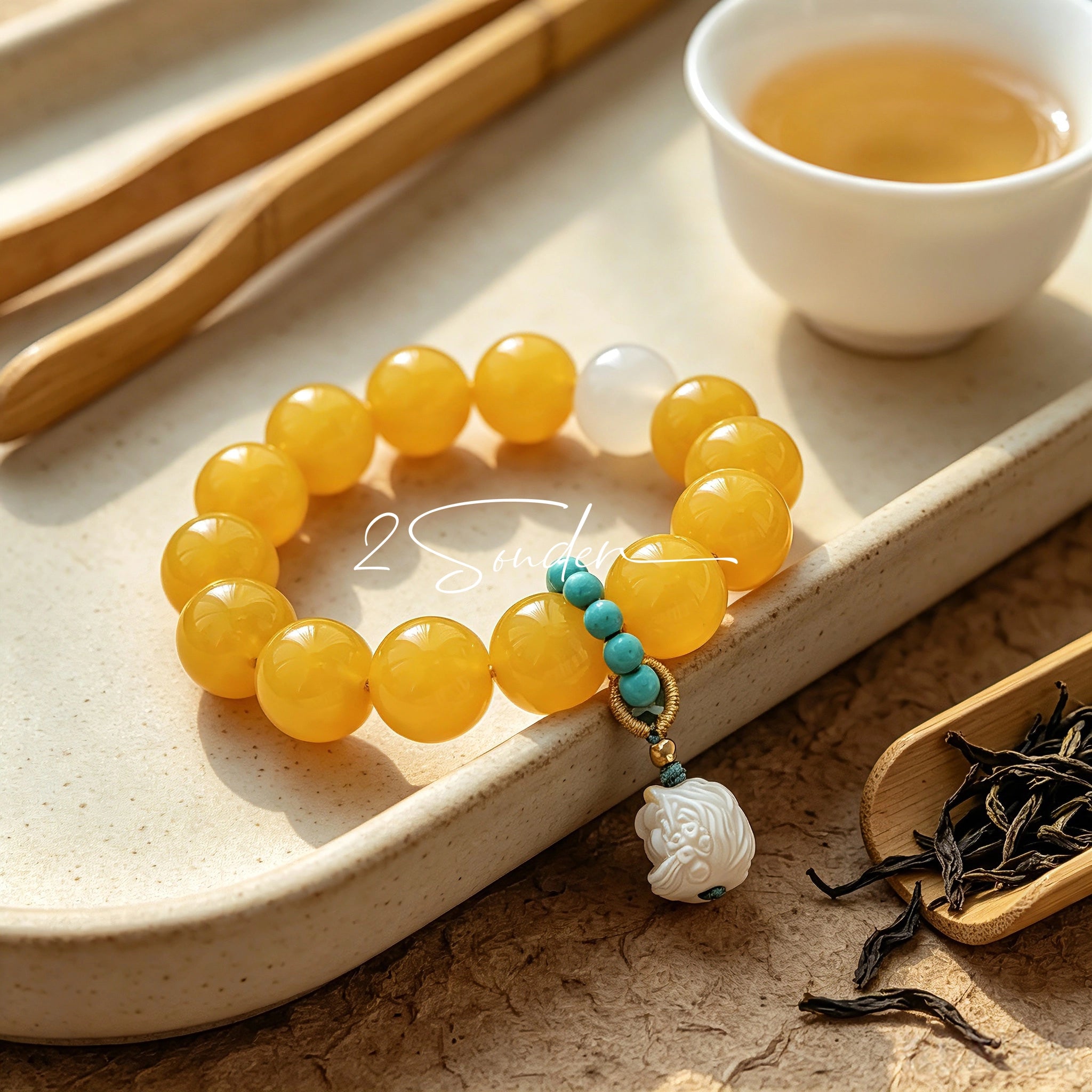 This handcrafted bracelet features glossy 14mm yellow agate beads paired with one white agate bead. It is accented with turquoise beads and finished with a detailed mammoth ivory guardian lion charm, bringing a warm vintage ethnic vibe.