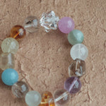 Soft blues, royal purples, warm golds, gentle greens, and misty whites glide like watercolor on silk.